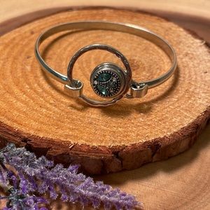 Silver bangle with pretty turquoise stones inlet.